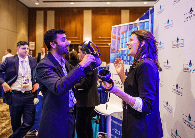 Image showing an exhibitor interacting with a visitor on their booth at CMA Shipping.