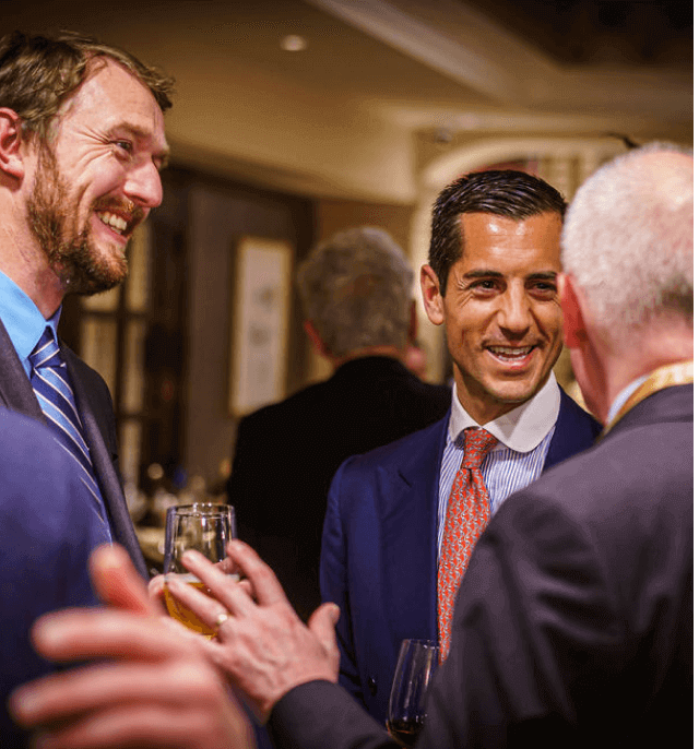 3 men networking at CMA